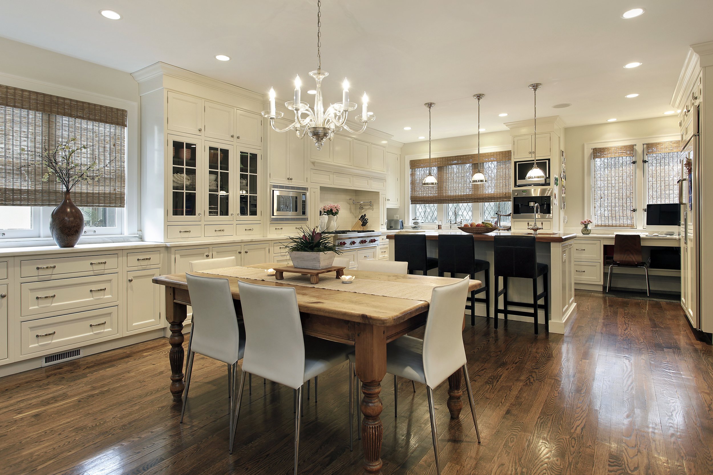 A professional photograph of a spacious open-concept kitchen